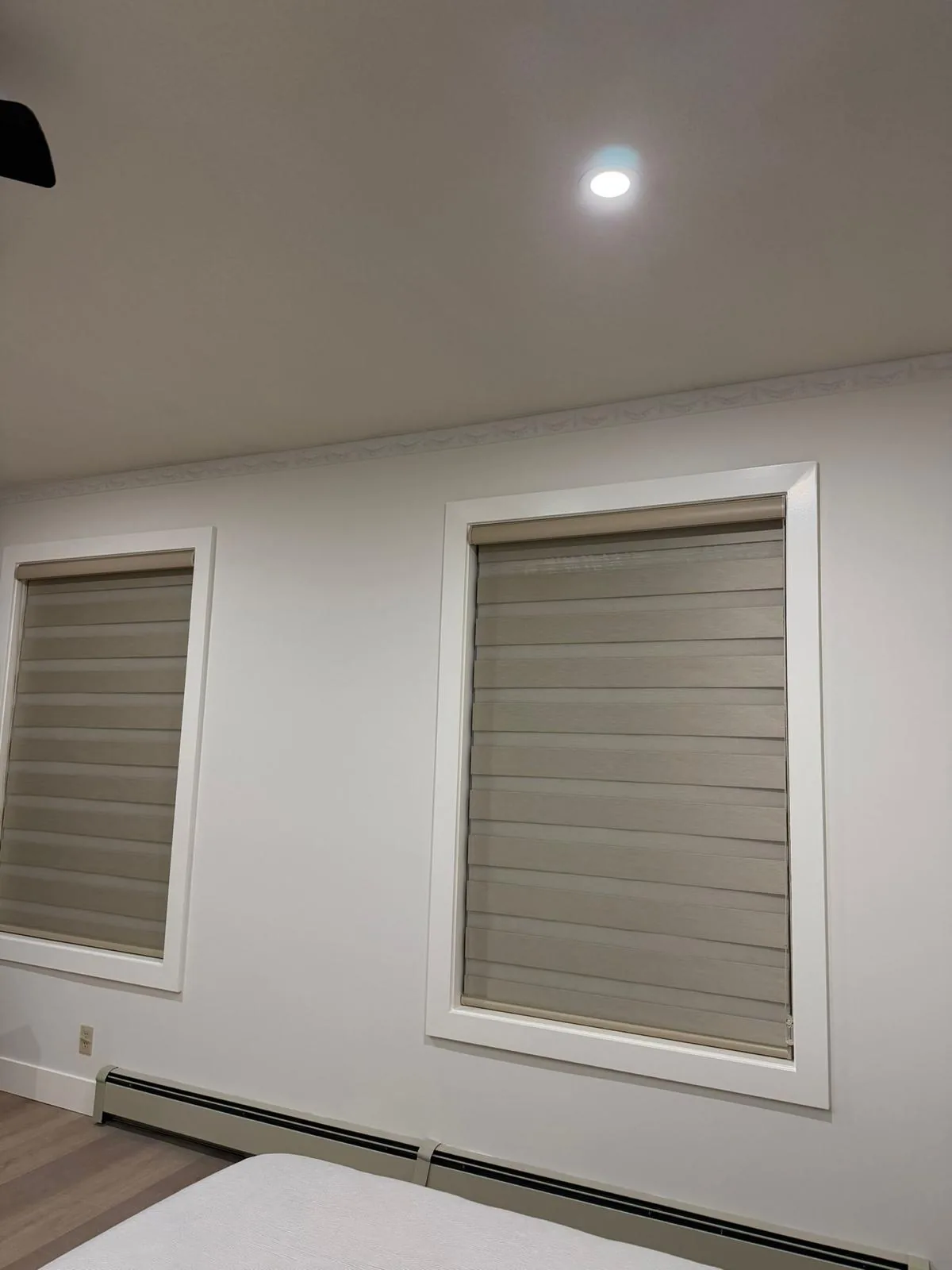 Two zebra blinds fitted over bedroom windows