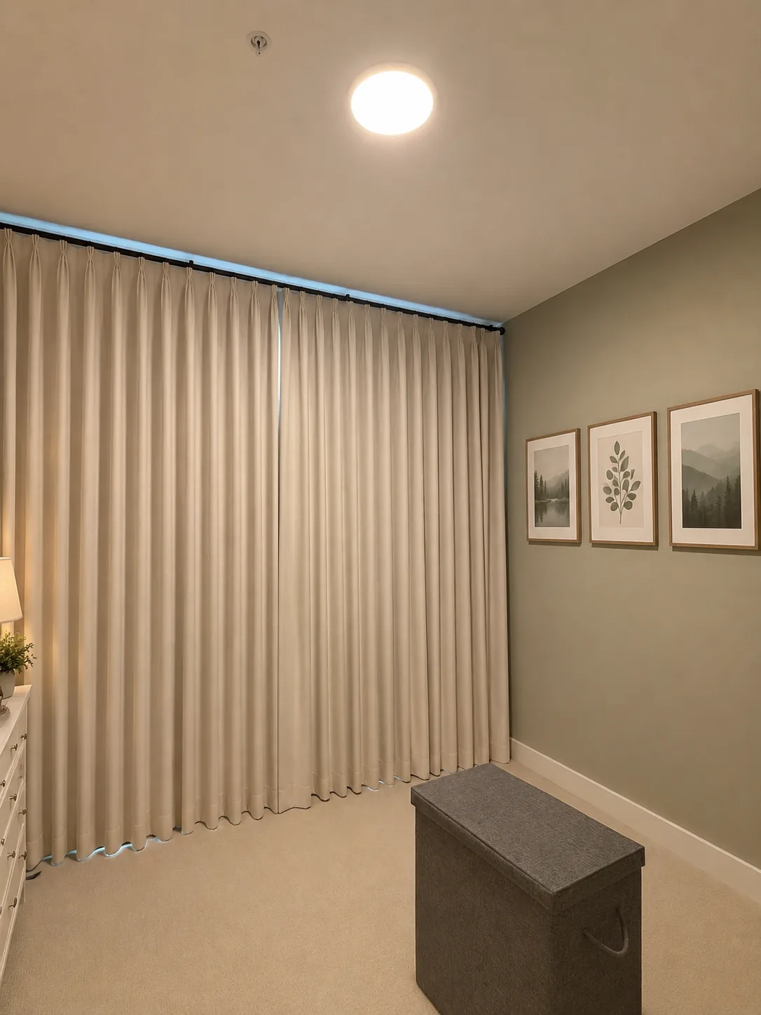 Floor-to-ceiling beige drapes in a modern room