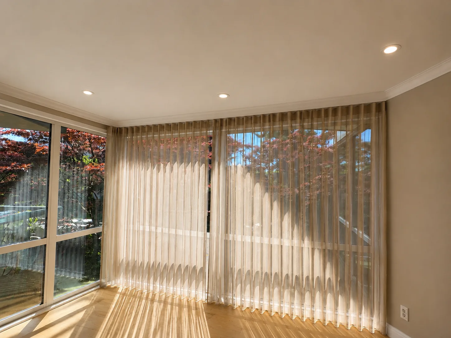 Vertical blinds wrapping a bright corner window
