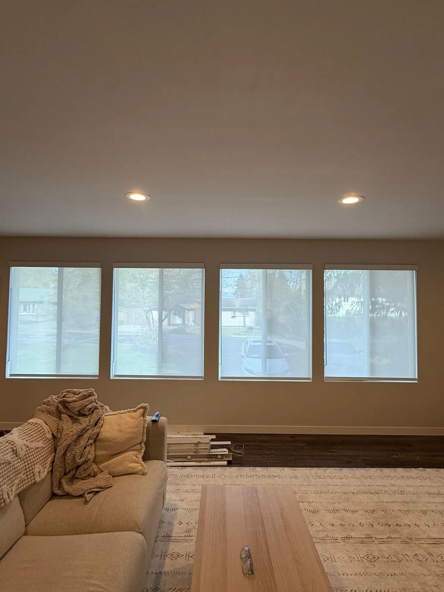 Light-filtering shades across living room windows